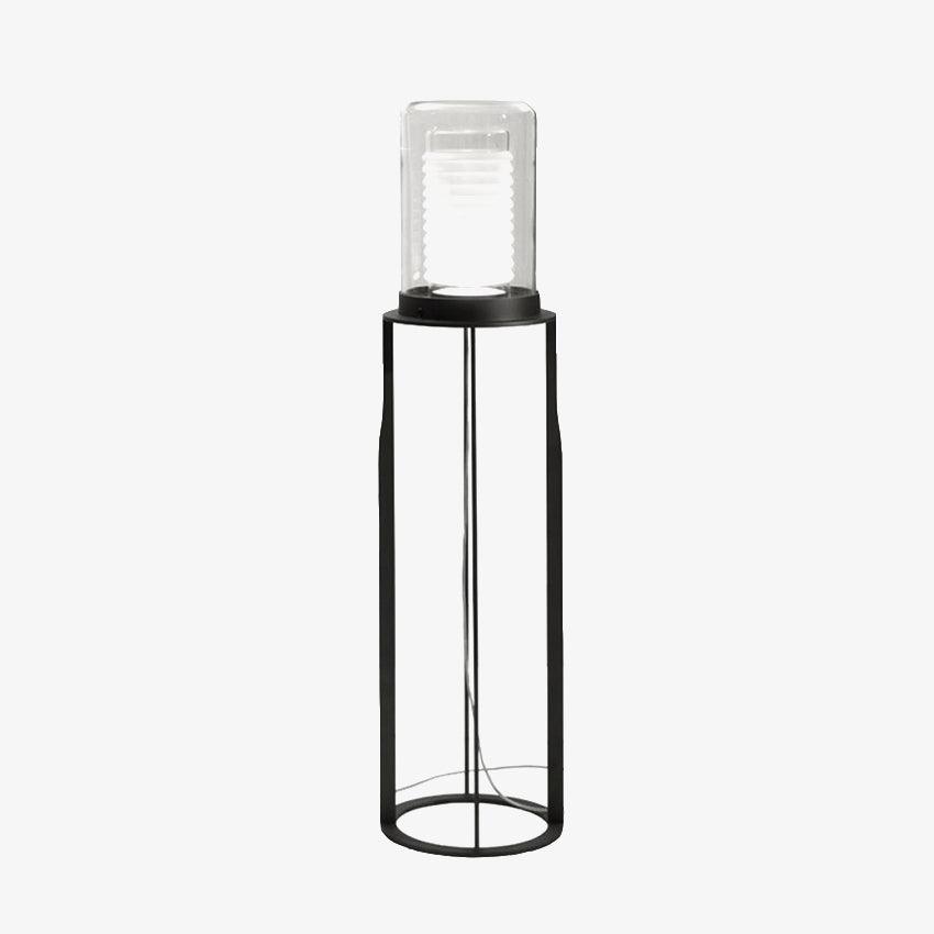 Lámpara de pie LED de doble cilindro de vidrio y estructura negra Navira – sobre fondo claro con vista lateral