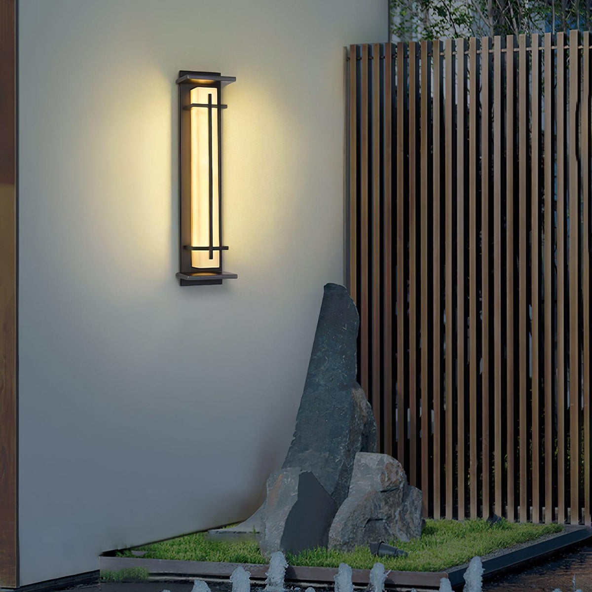 Aplique de pared exterior LED Xalba con efecto alabastro en una fachada al anochecer – imagen 8