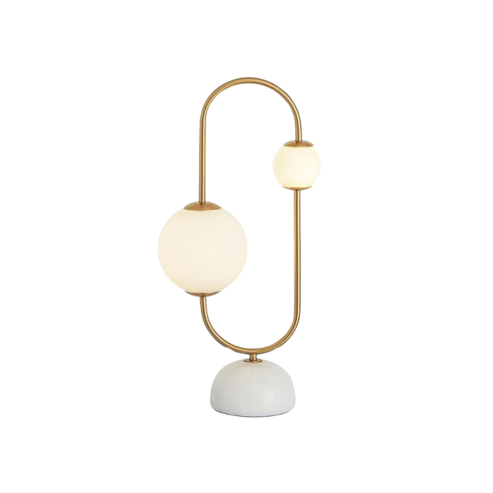 Lámpara de mesa Jeluna con aro dorado y globos de vidrio – encendida sobre fondo negro