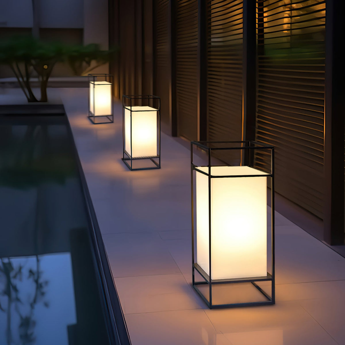 Farol de mesa para exterior Candilo en una terraza al anochecer – imagen 10