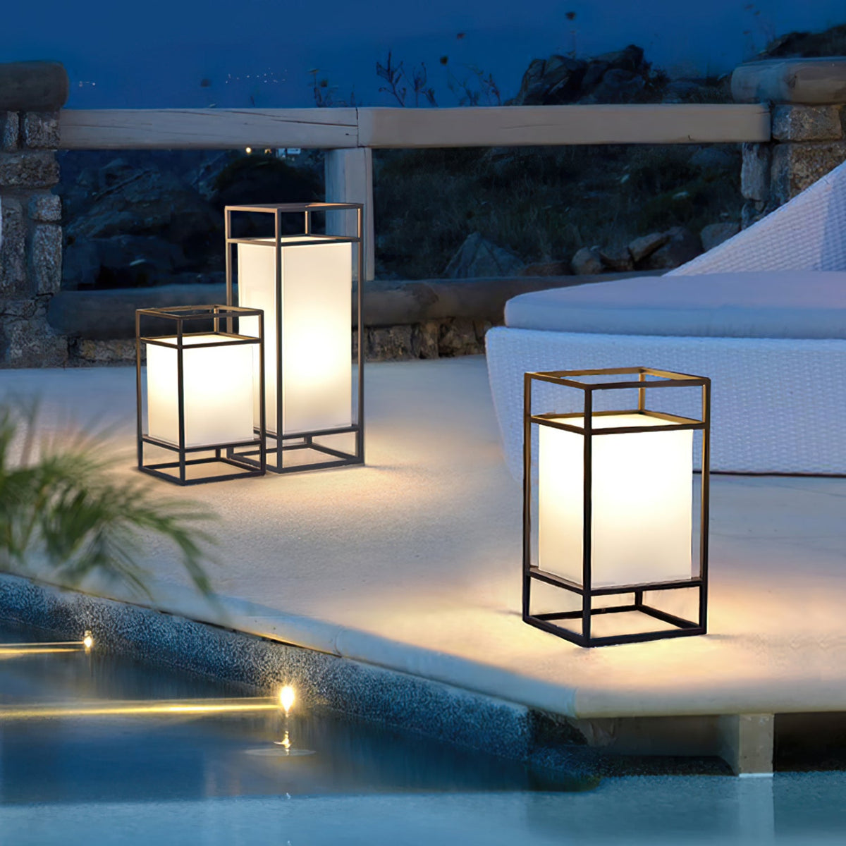 Farol de mesa para exterior Candilo en una terraza al anochecer – imagen 7