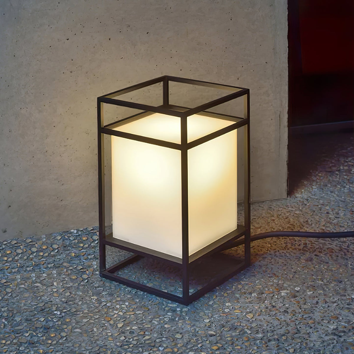 Farol de mesa para exterior Candilo en una terraza al anochecer – imagen 11