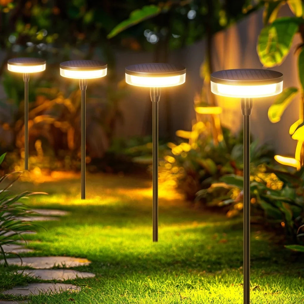 Baliza solar de jardín Oziela – balizas iluminando un camino de piedras