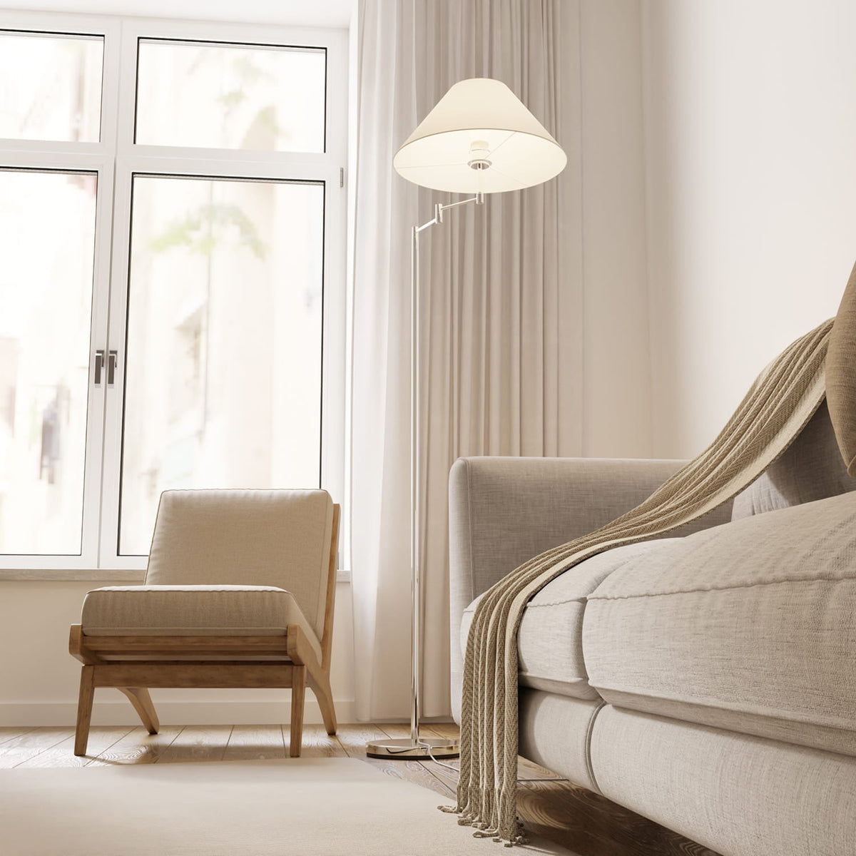 Lámpara de pie con brazo giratorio Pavena junto a un sillón – imagen 6