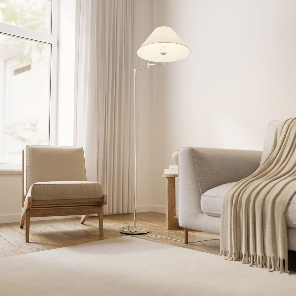 Lámpara de pie con brazo giratorio Pavena junto a un sillón – imagen 4