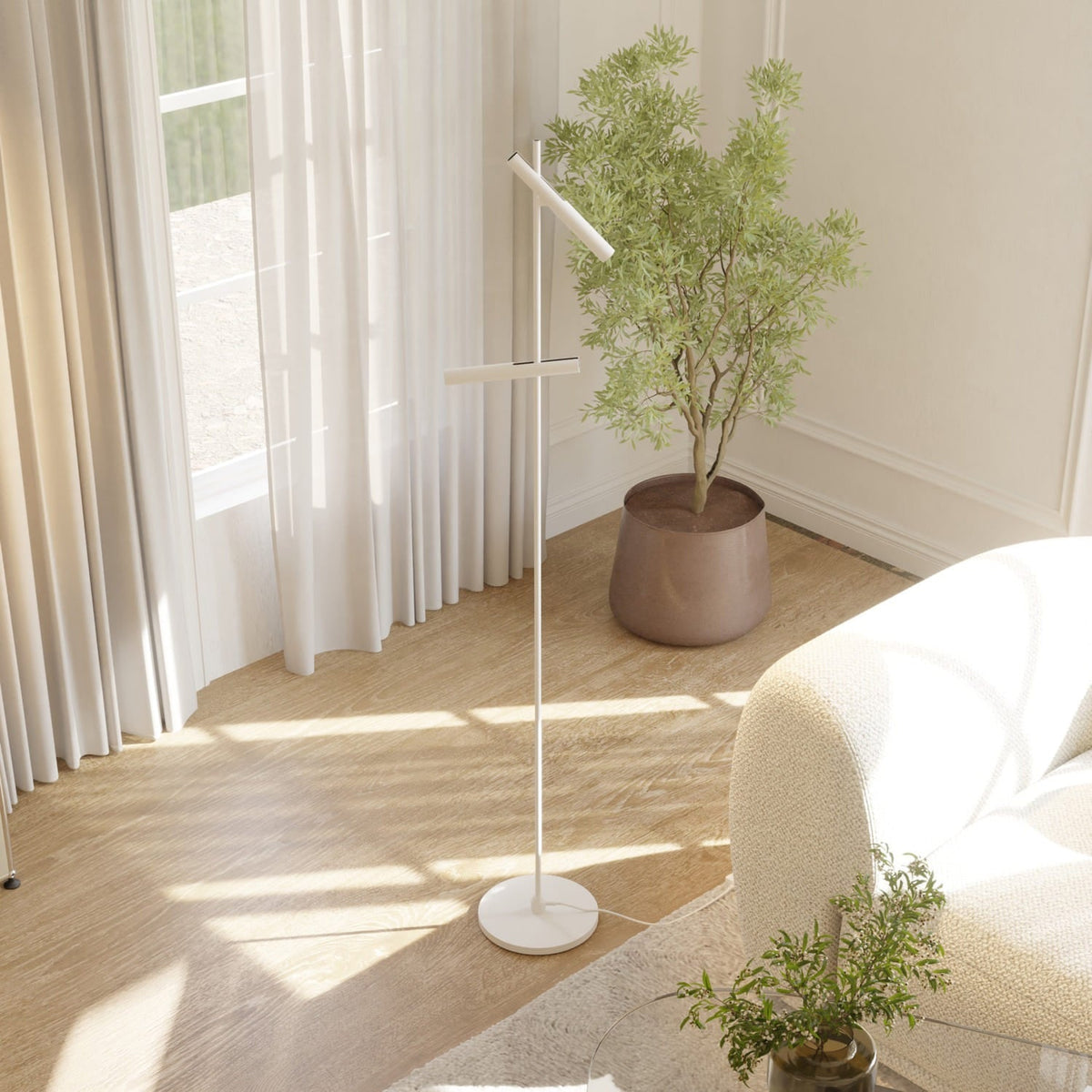 Lámpara de pie LED con dos focos orientables Caliro junto a un sillón en el salón – imagen 5