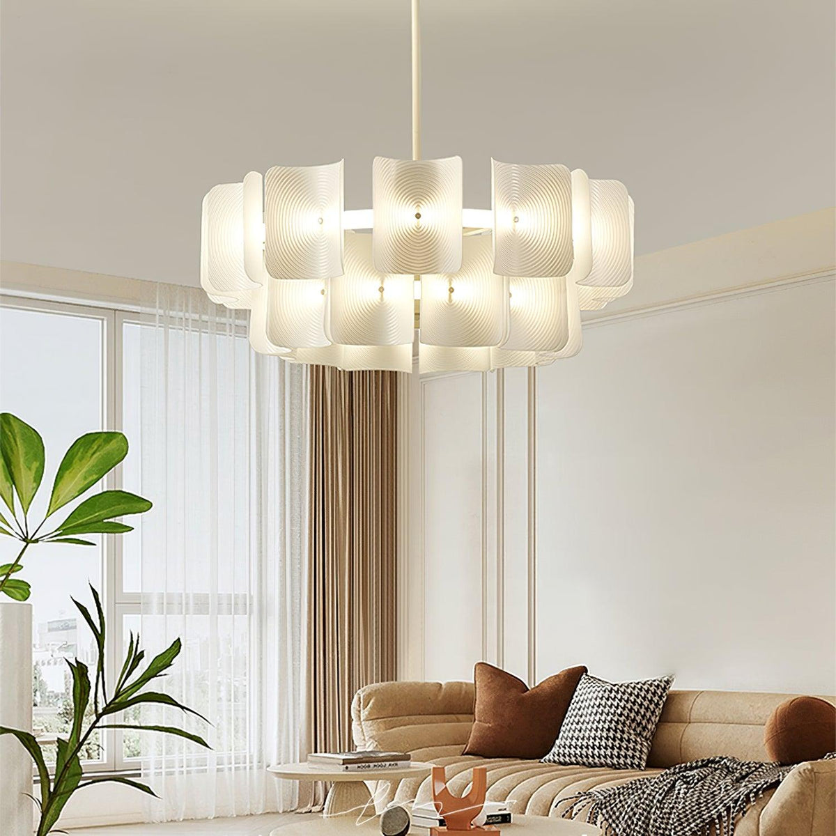Lámpara de araña LED Corvela – en un salón luminoso con sofá