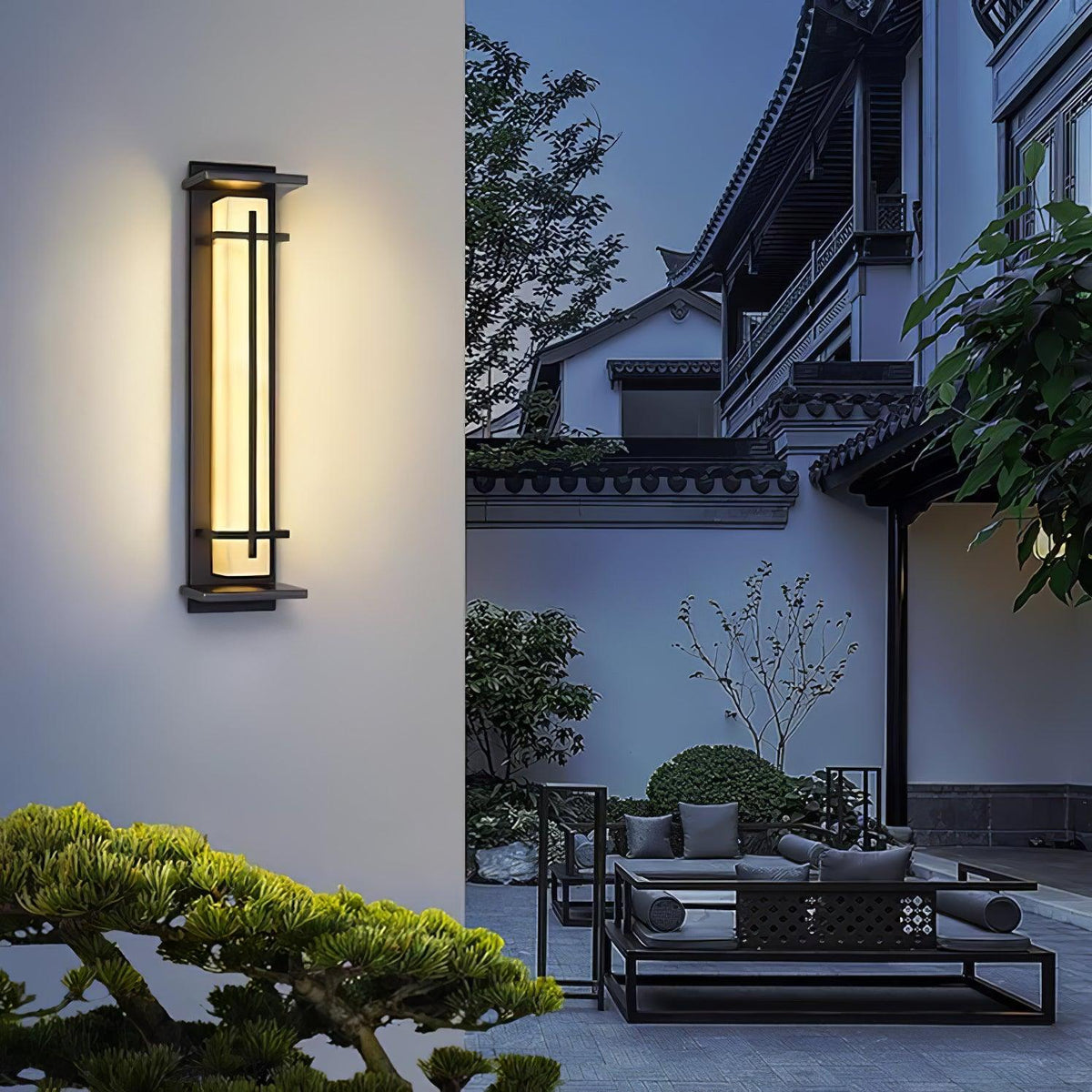 Aplique de pared exterior LED Xalba con efecto alabastro en una fachada al anochecer – imagen 11