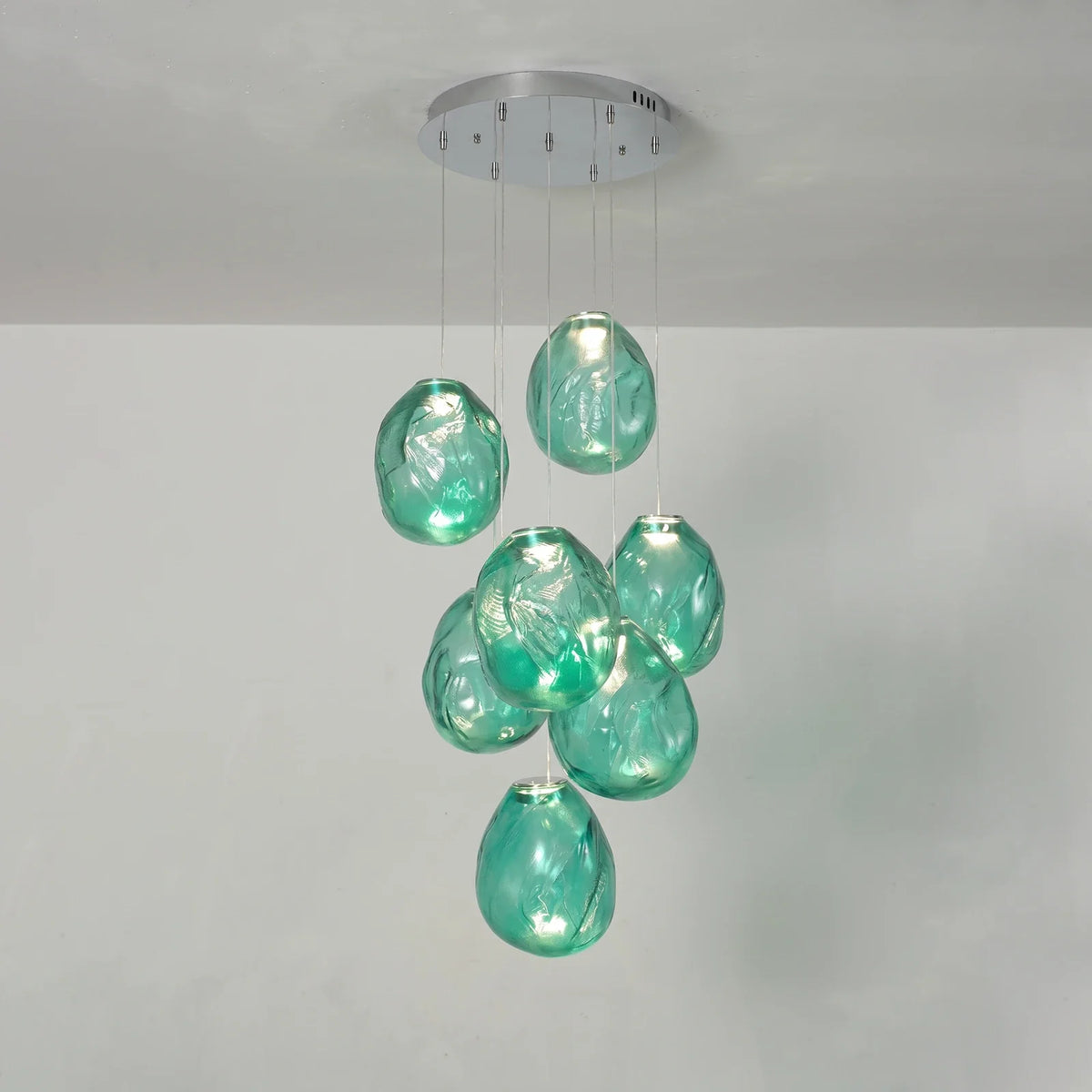 Lámpara de araña de cristal texturizado Guisela – con 7 luces en cristal verde