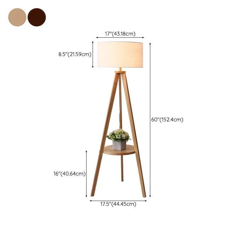 Lámpara de pie trípode de madera con estante y pantalla cilíndrica Jorvia – con las medidas y los dos acabados