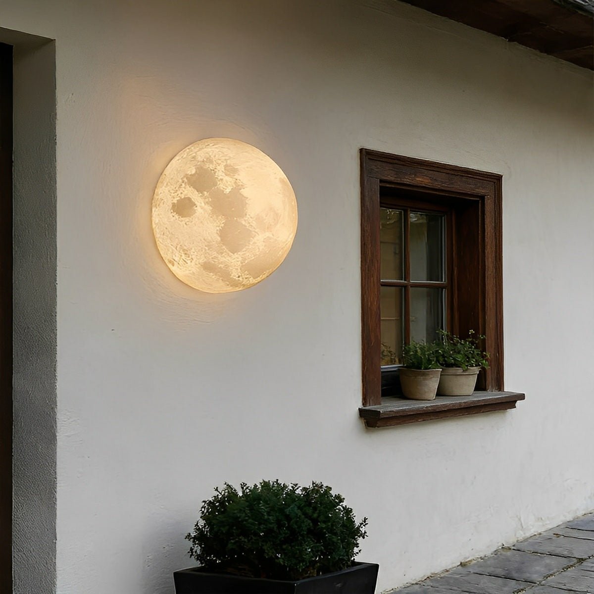 Aplique de pared exterior Lunoro – en una pared blanca