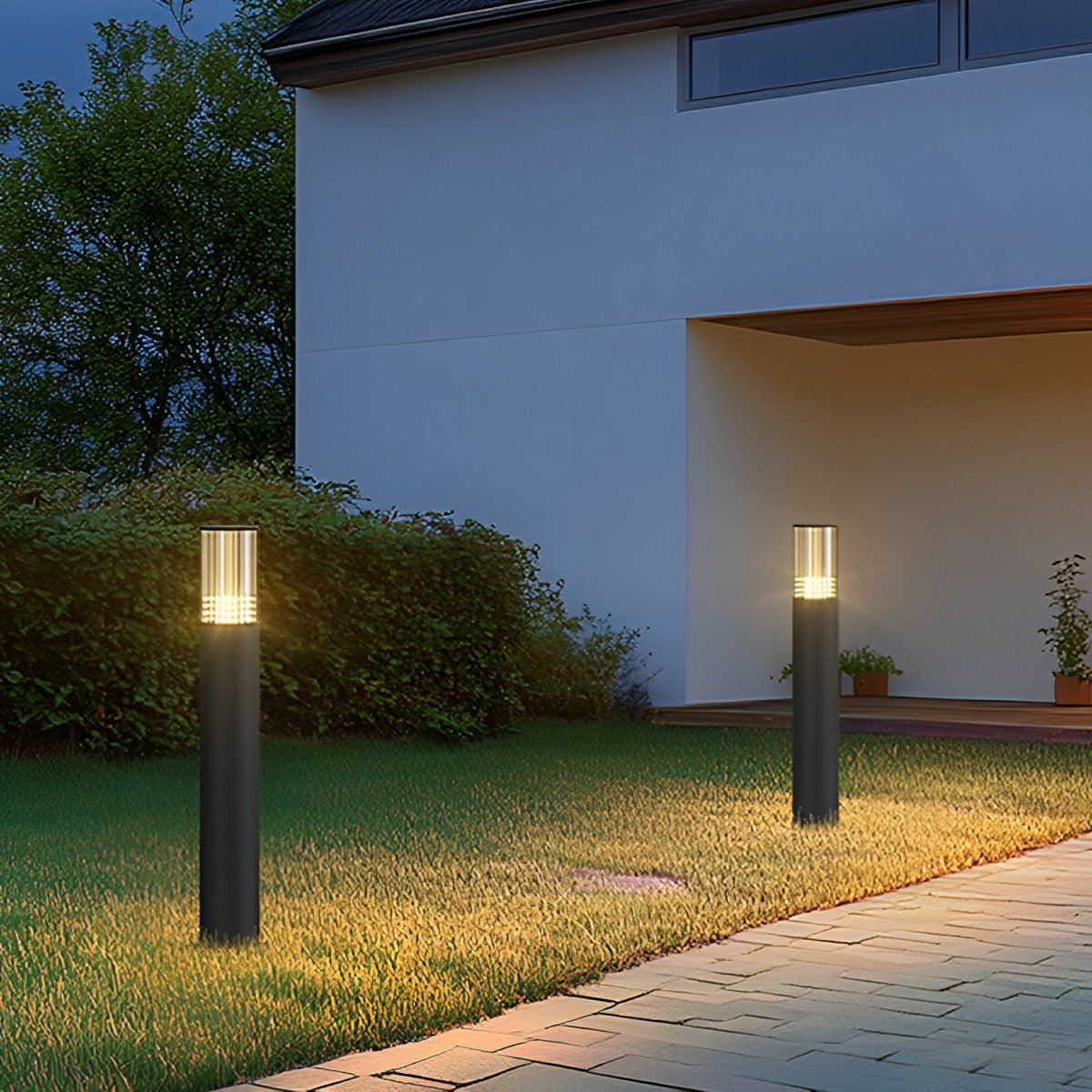 Baliza exterior LED Mostela – dos balizas junto a una fachada moderna