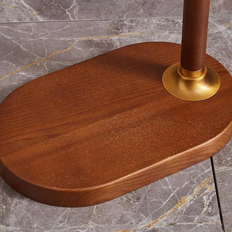 Lámpara de pie con pantalla plisada y brazo articulado Plisana – detalle de la base de madera