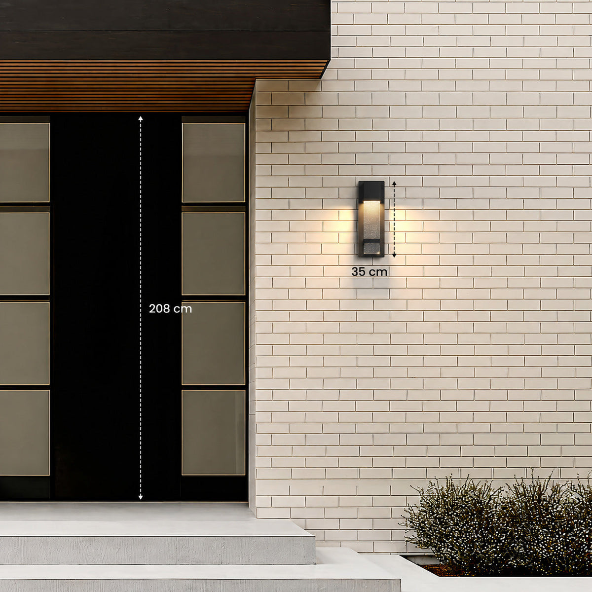 Aplique de pared exterior Yestrela con cristal de burbujas – altura de 35 cm junto a una puerta