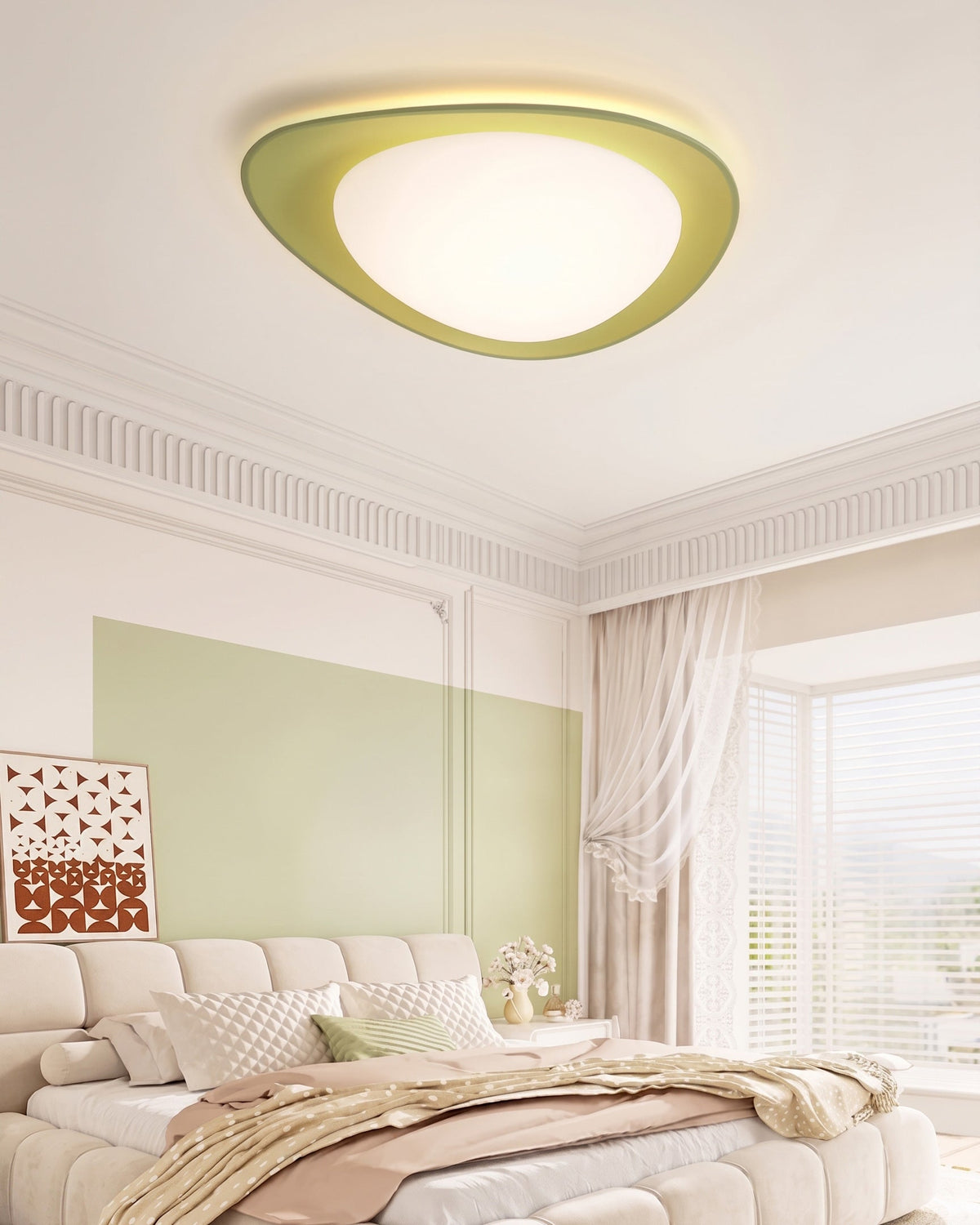 Plafón LED en forma de canto rodado Cantela – con aro verde en un dormitorio