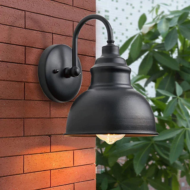 Aplique de pared exterior Jamira – sobre una pared de ladrillo
