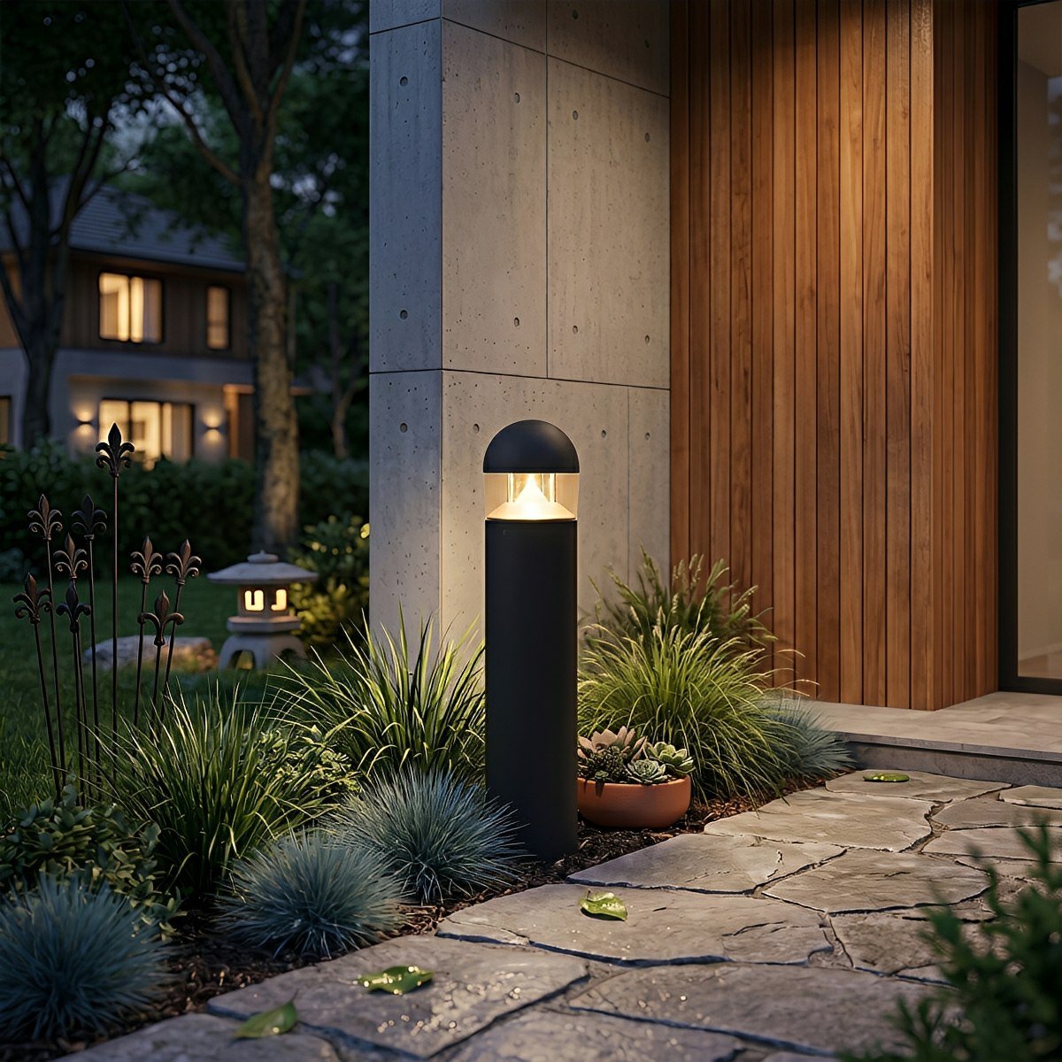 Baliza de jardín LED Obeluna – redonda junto a una fachada de madera