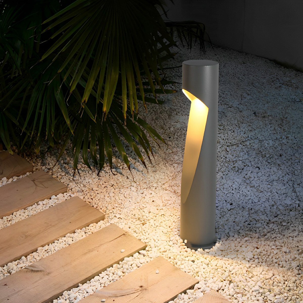 Baliza LED de jardín Osmira – sobre grava junto a una tarima