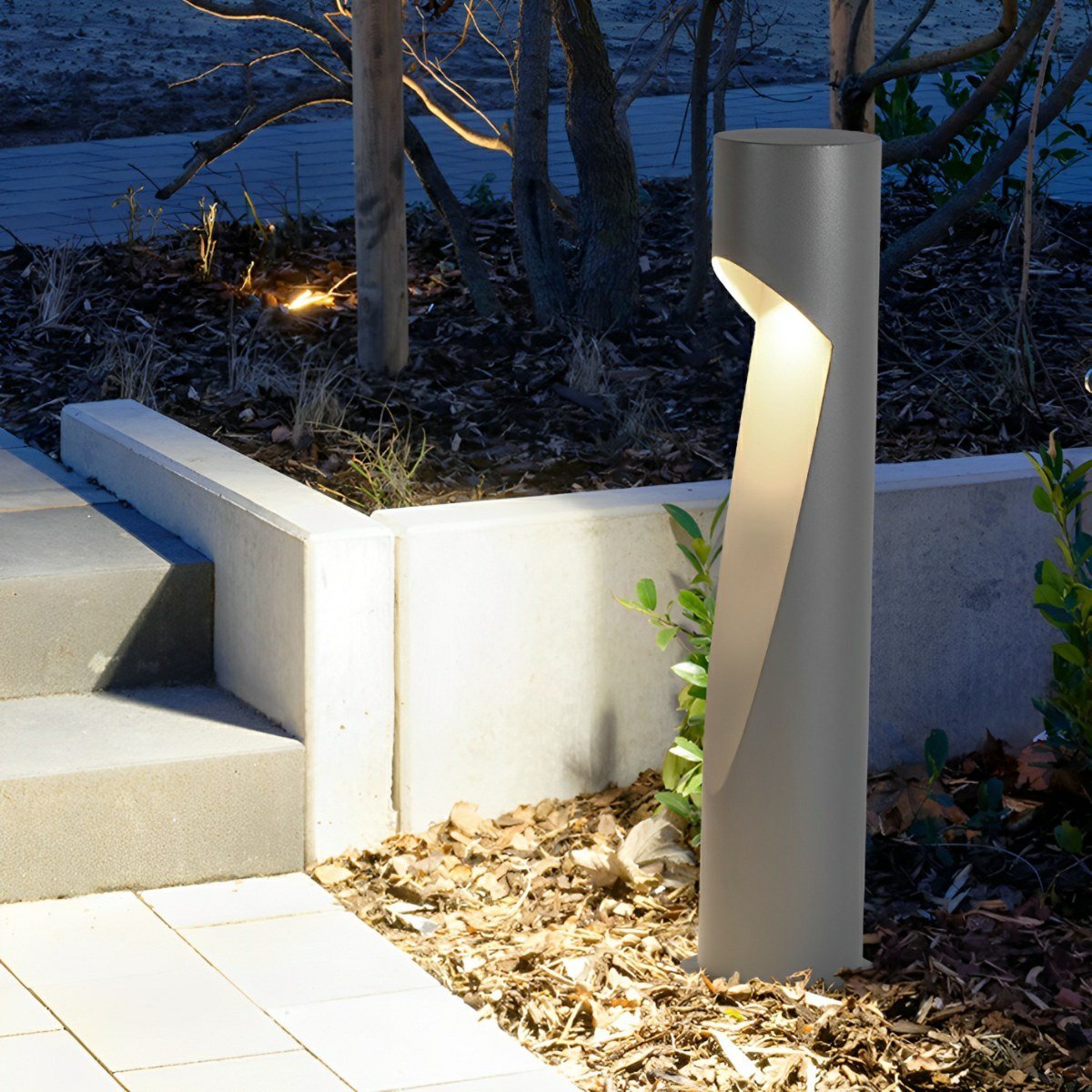 Baliza LED de jardín Osmira – junto a un parterre