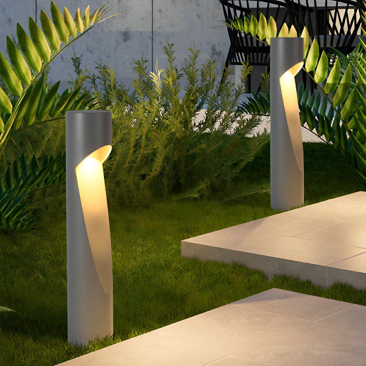 Baliza LED de jardín Osmira – en el césped de un jardín
