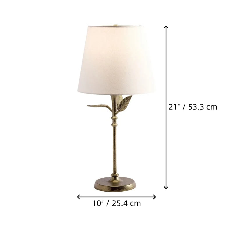 Lámpara de mesa con hojas de metal Yedrina sobre una mesa auxiliar junto al sofá – imagen 15